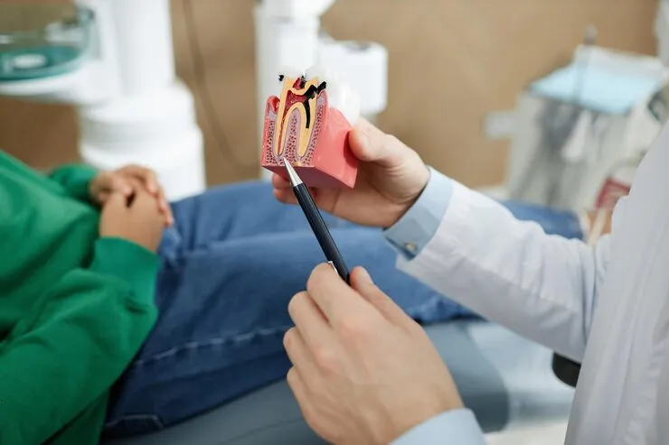 Dentist providing root canal therapy with modern equipment at Smile Dental PK dental clinic